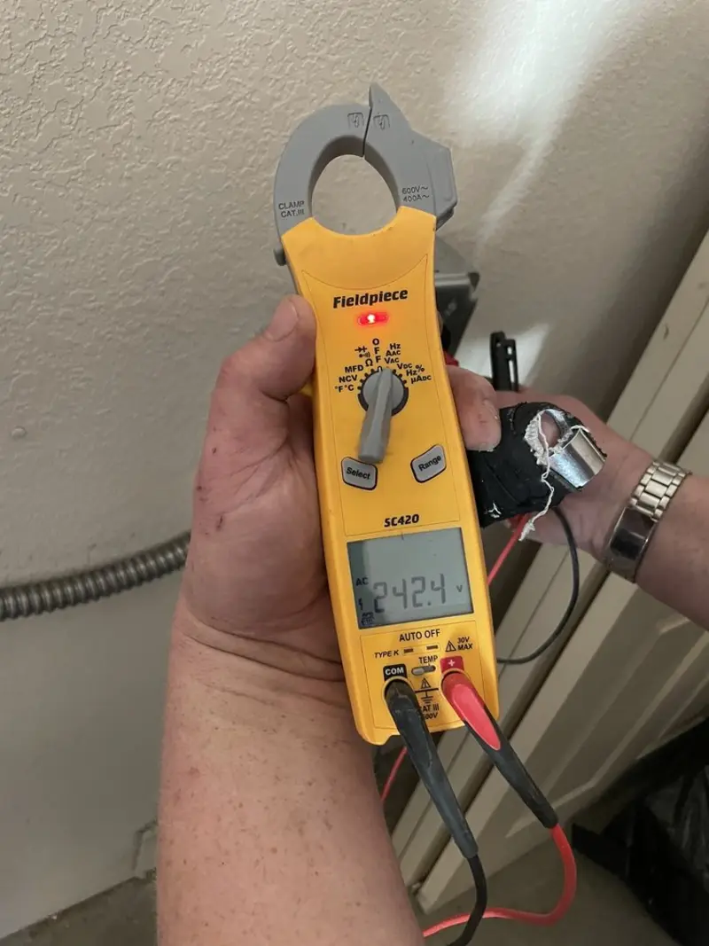 Voltage testing with clamp meter during Hot Tub / Pool Electrical Wiring in Alfred